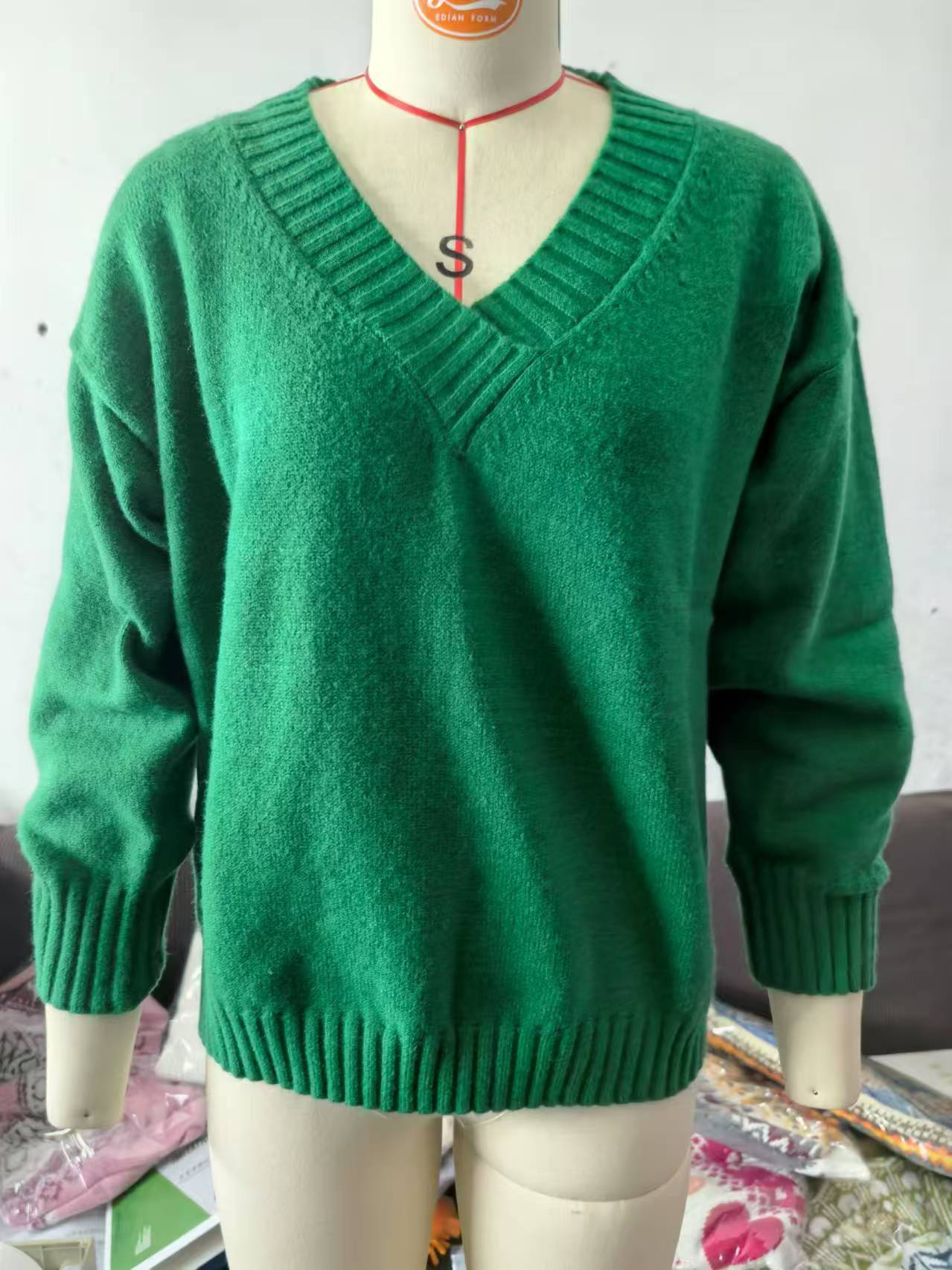 Women's V-Neck Knit Sweater: Solid Color, Relaxed Fit.